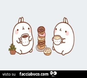 Coniglietti fanno colazione con ciambelle